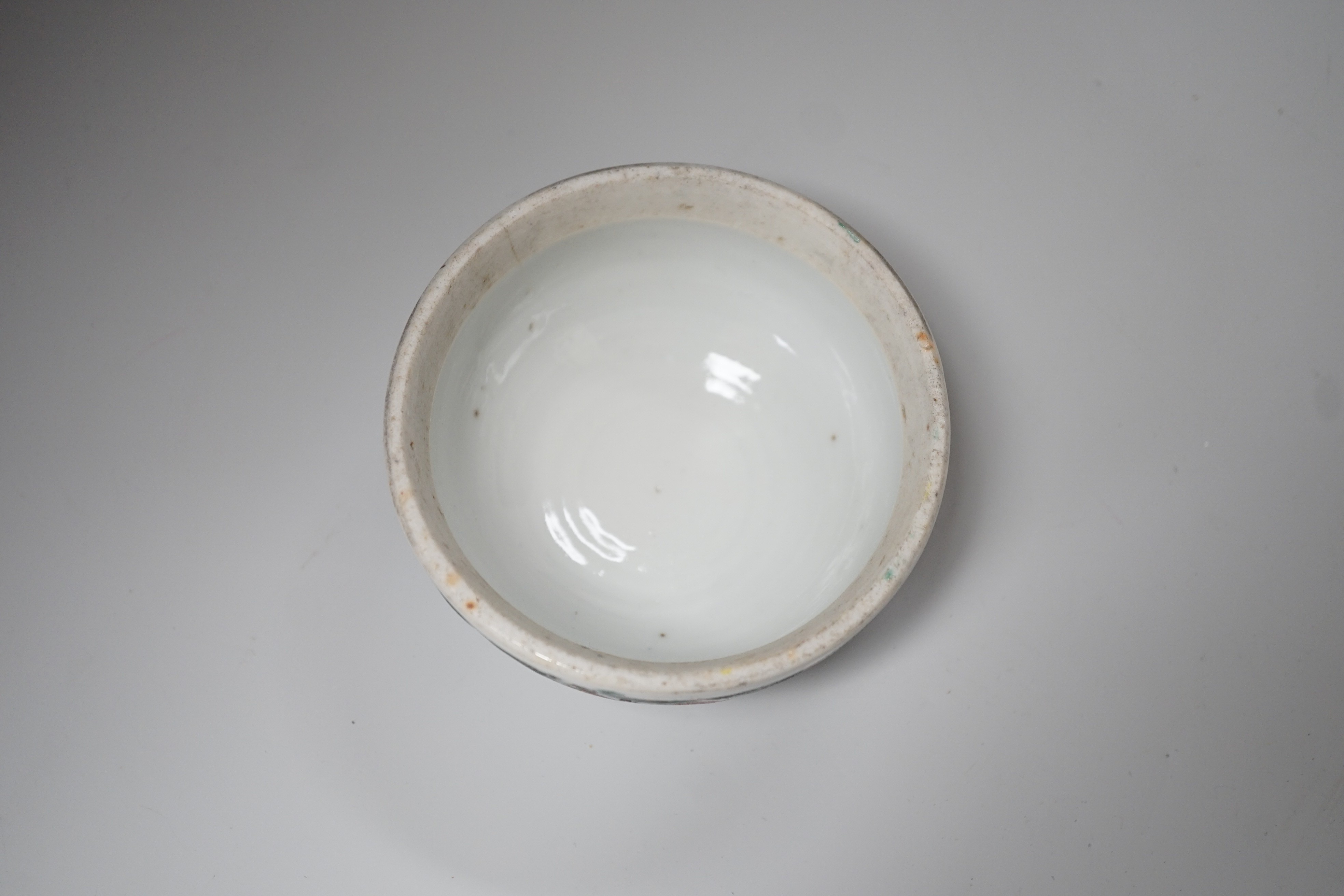 A Chinese blue and white brushpot, enamelled jar, brush pot, famille verte jar cover and a Japanese blue and white tea bowl and cover. Tallest 18cm